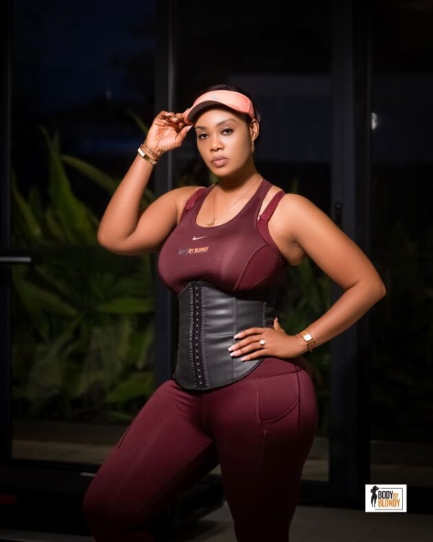 Model wearing latex waist trainer for slimming and posture support by Body by Blondy